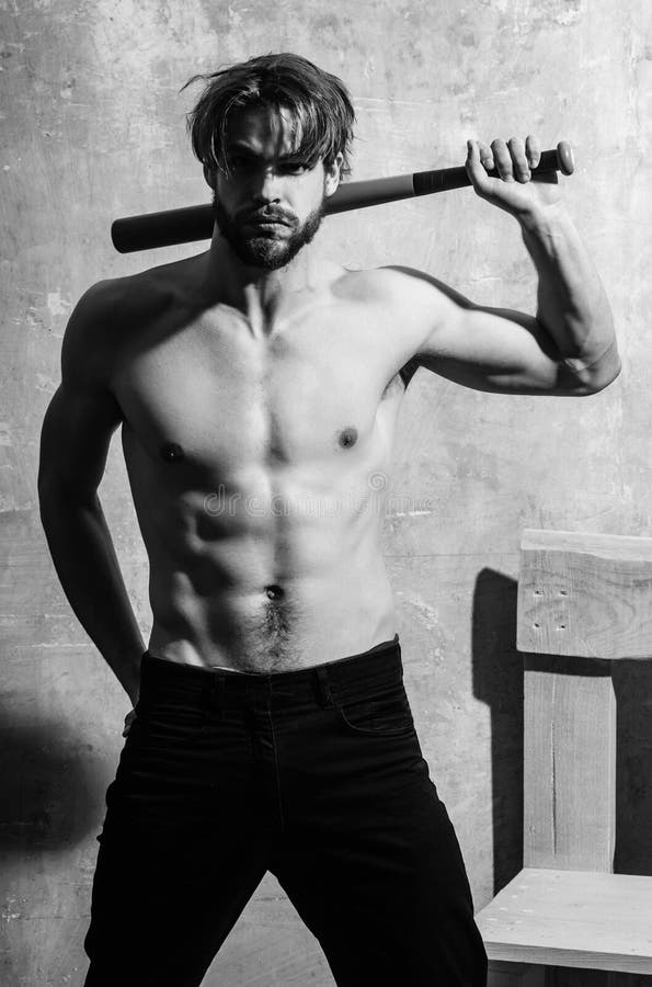 Bearded macho standing with green baseball bat stock photos Bearded macho standing with green baseball bat stock photos