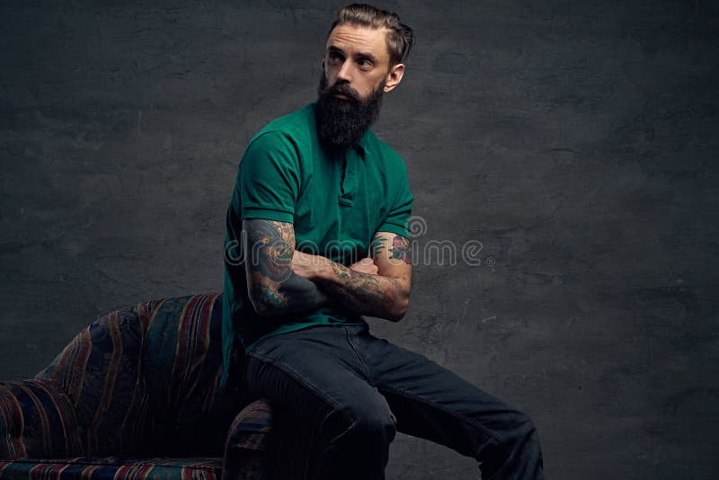 Tattooed Bearded Male Sits on a Chair. Stock Image - Image of lifestyle ...
