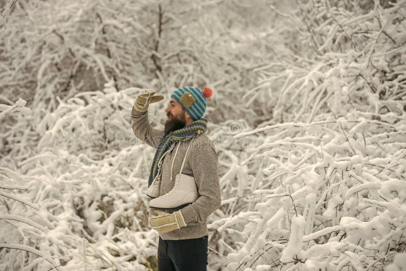 Bearded man with skates in snowy forest. royalty free stock photos Bearded man with skates in snowy forest. royalty free stock photos
