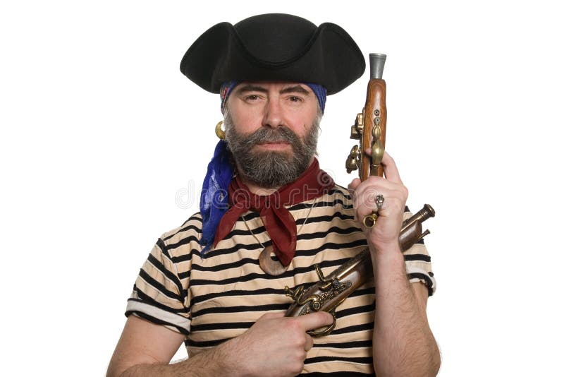 Bearded pirate in tricorn hat with a muskets. royalty free stock images