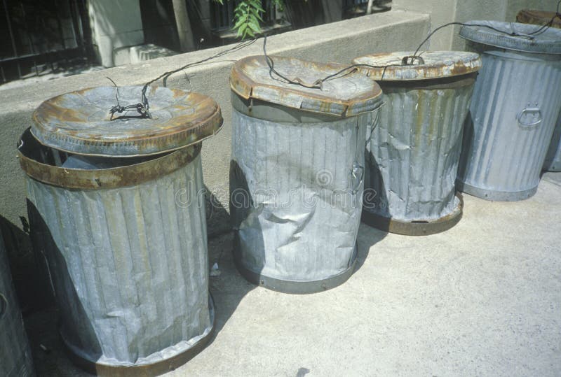 Beaten and dented New York trash cans