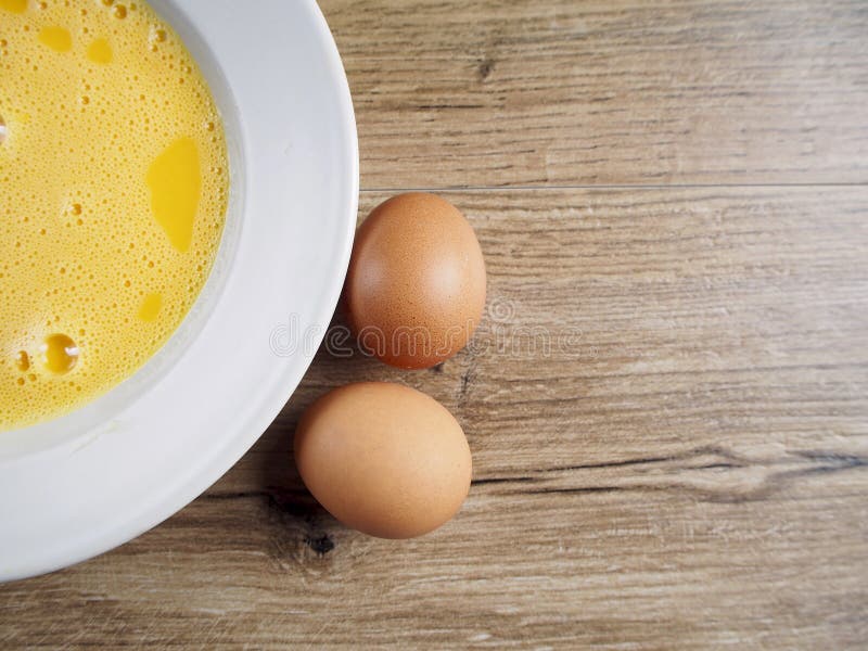 Egg and beaten eggs stock photo. Image of risk, cracked 12546008
