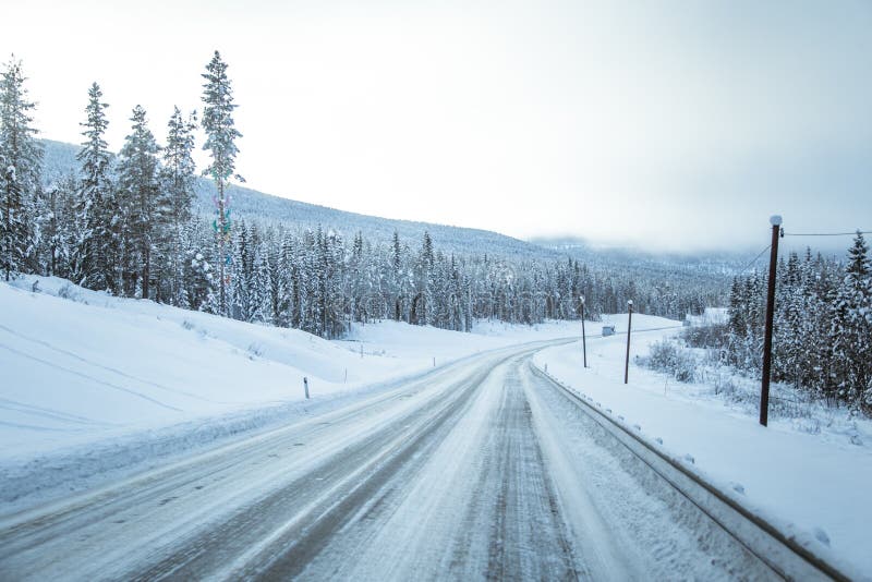 A beatiful winter scenery with a road. Woods in Norway. Drive, traffic.