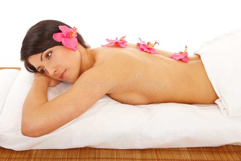 Beatutiful Woman Relaxing Spa with Flowers