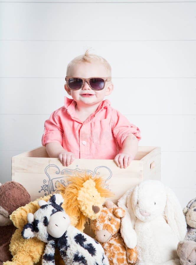Beau com seus brinquedos do luxuoso fotografia de stock Beau com seus brinquedos do luxuoso fotografia de stock
