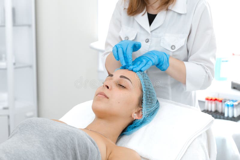 Beautician Makes A Young Beautiful Girl A Relaxing And Wellness Facial Massage Facial Care And