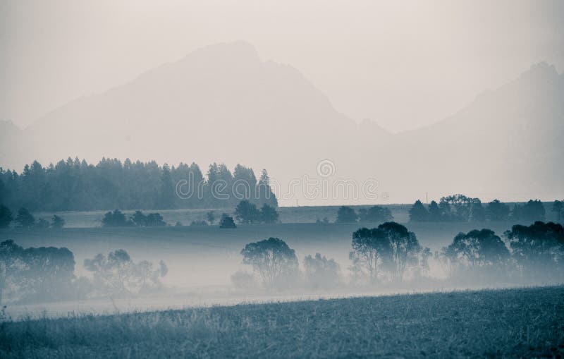 A beautiful, abstract monochrome mountain landscape in blue tonality.