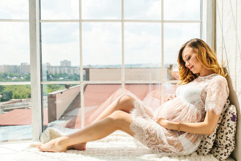 Beautiful adult pregnant woman. Waiting for the baby. Pregnancy. Care, tenderness, motherhood, childbirth.