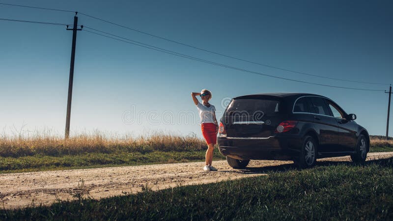Beautiful adult woman enjoying road trip. Successful woman freedom holidays concept. Vacation, motivation, well-being, sightseeng royalty free stock image Beautiful adult woman enjoying road trip. Successful woman freedom holidays concept. Vacation, motivation, well-being, sightseeng royalty free stock image