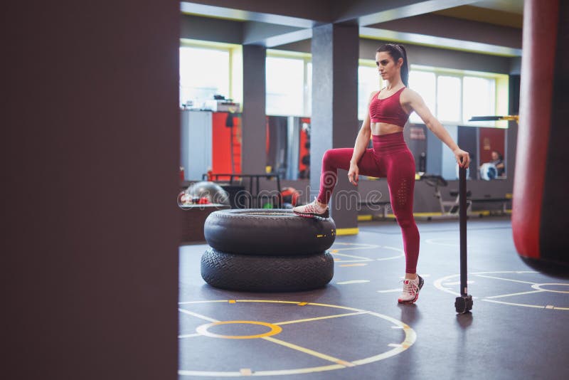 Confident Middle Aged Sportswoman with Hammer in Gym Stock Image - Image of  active, confident: 136575445