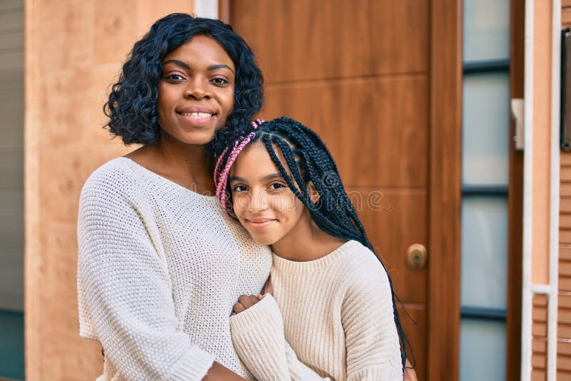 Beautiful African American Mother And Daughter Smiling Happy And Hugging Stock Image Image Of 