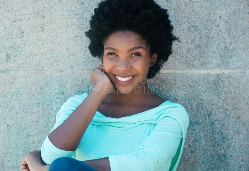 Beautiful african american woman in a light green shirt stock image Beautiful african american woman in a light green shirt stock image