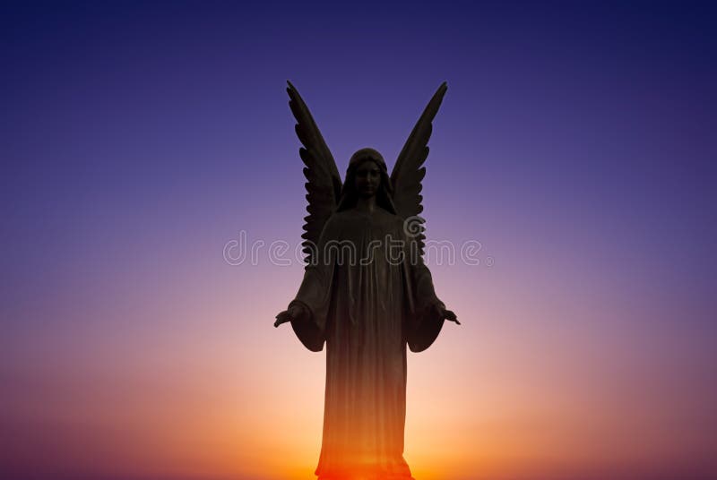 Beautiful angel in heaven over bright sunset