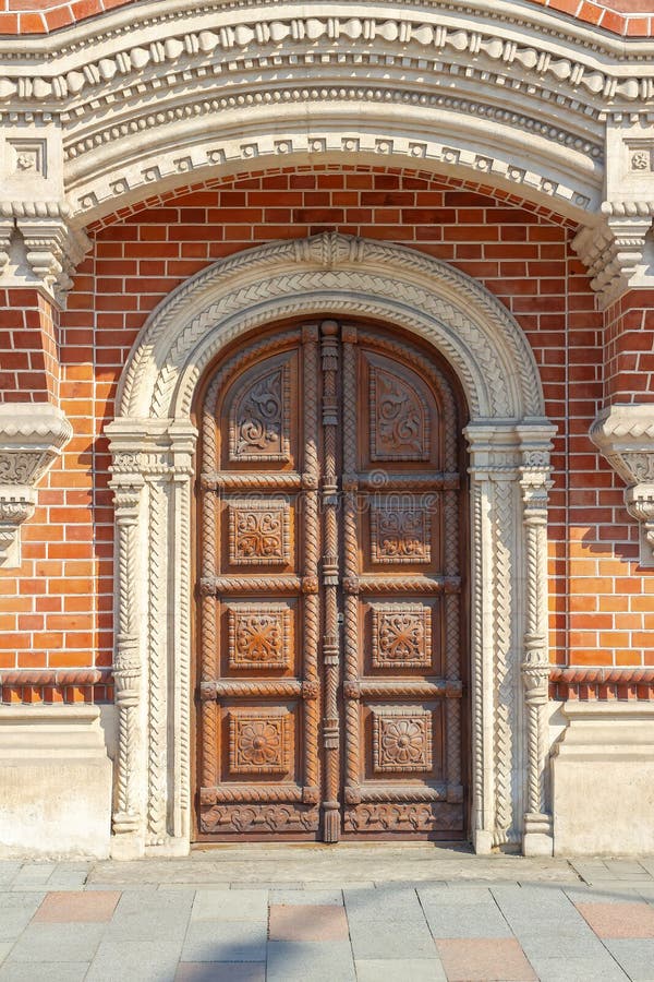 Beautiful arched door, decorated with carvings royalty free stock photo Beautiful arched door, decorated with carvings royalty free stock photo
