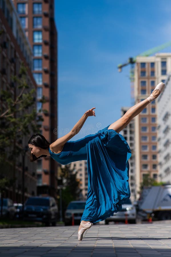 Beautiful Asian Ballerina Dancing Outdoors. Urban Landscape. Stock ...