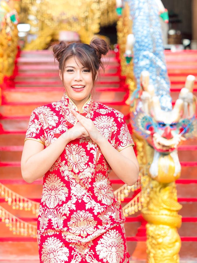 Asian Girl in a Chinese National Costume Raises His Hands To Bow Stock ...