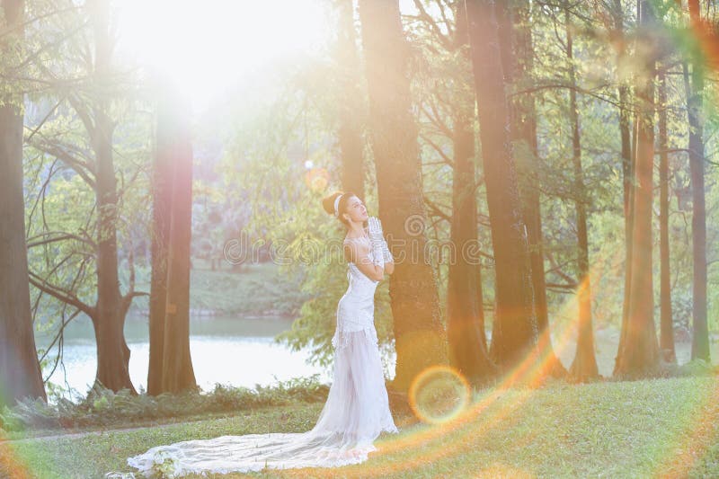 Beautiful Asian girl in a wedding dress showing happy moments stock images Beautiful Asian girl in a wedding dress showing happy moments stock images