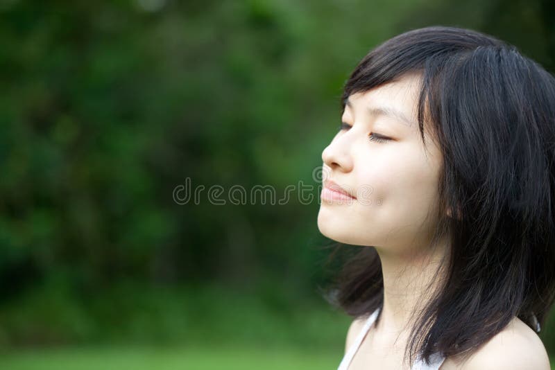 Beautiful Asian girl enjoying outdoors
