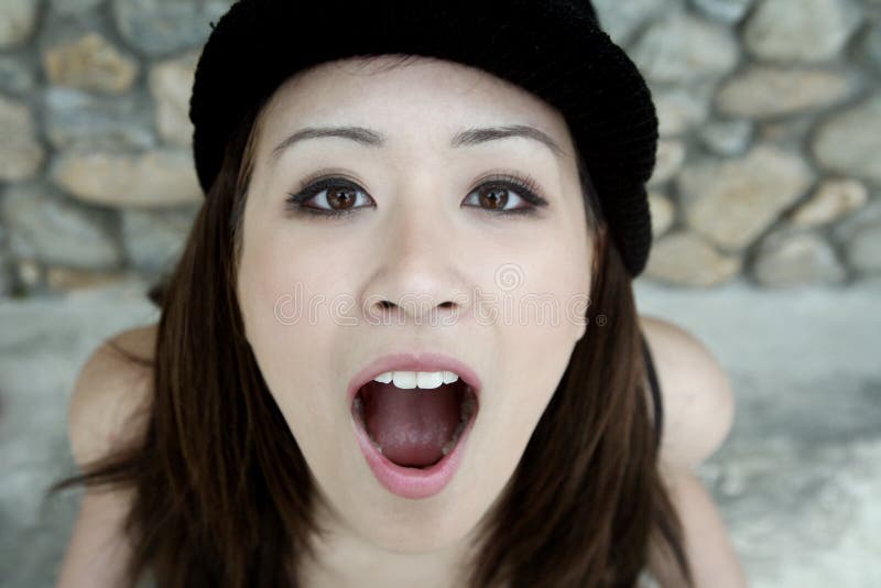 Beautiful Asian girl with mouth open