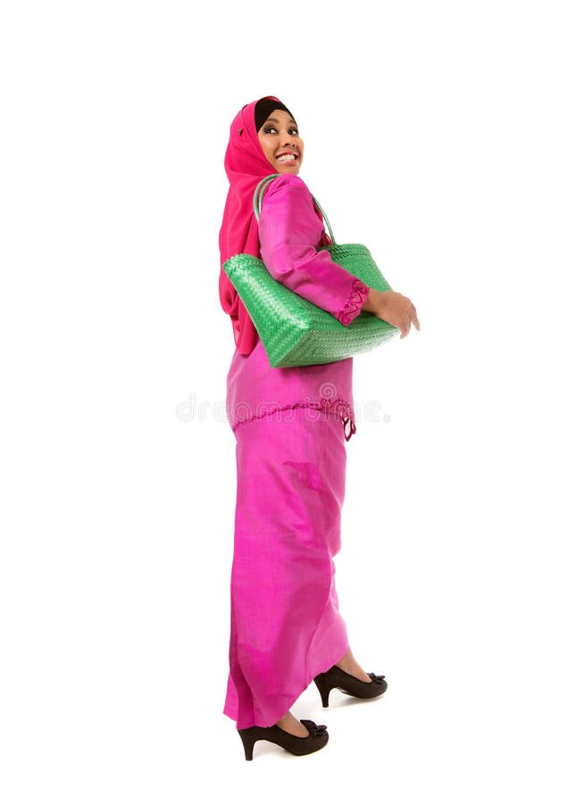 Beautiful asian muslimah woman with green wicker tote bags.Isolated stock photo Beautiful asian muslimah woman with green wicker tote bags.Isolated stock photo