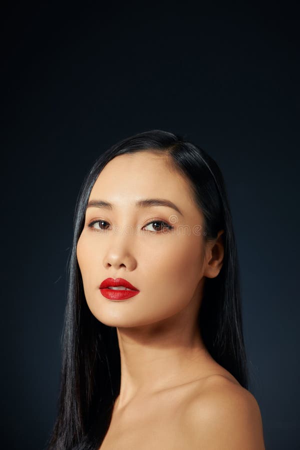 portrait of sexy asian woman with long hair, stylish earrings