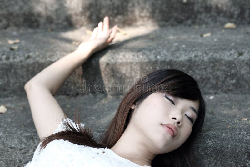 Beautiful Young Unconscious Knocked Out Woman Stock Photo