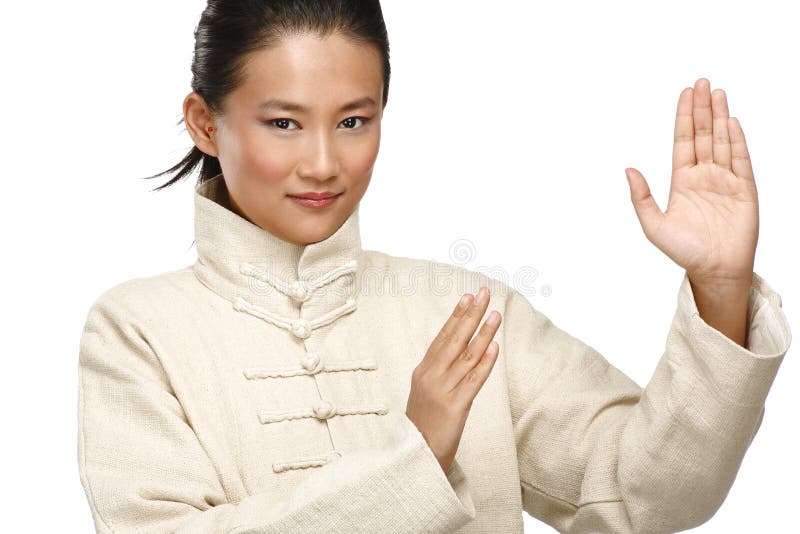 Beautiful asian woman make kung fu gesture