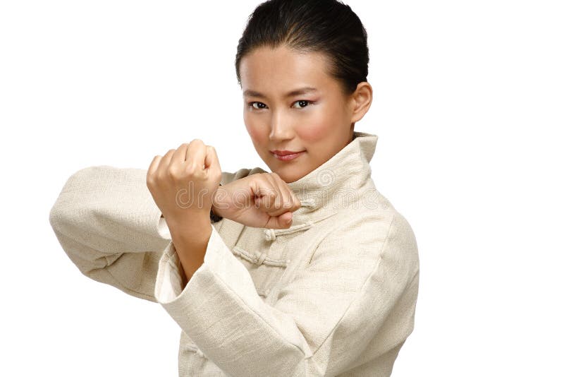 Beautiful asian woman make kung fu gesture