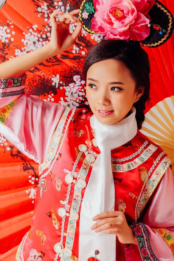 Beautiful Asian women wear Chinese Qing Dynasty clothes. When shooting, the model should change into ancient clothes, dress up with retro makeup and modeling royalty free stock photo Beautiful Asian women wear Chinese Qing Dynasty clothes. When shooting, the model should change into ancient clothes, dress up with retro makeup and modeling royalty free stock photo