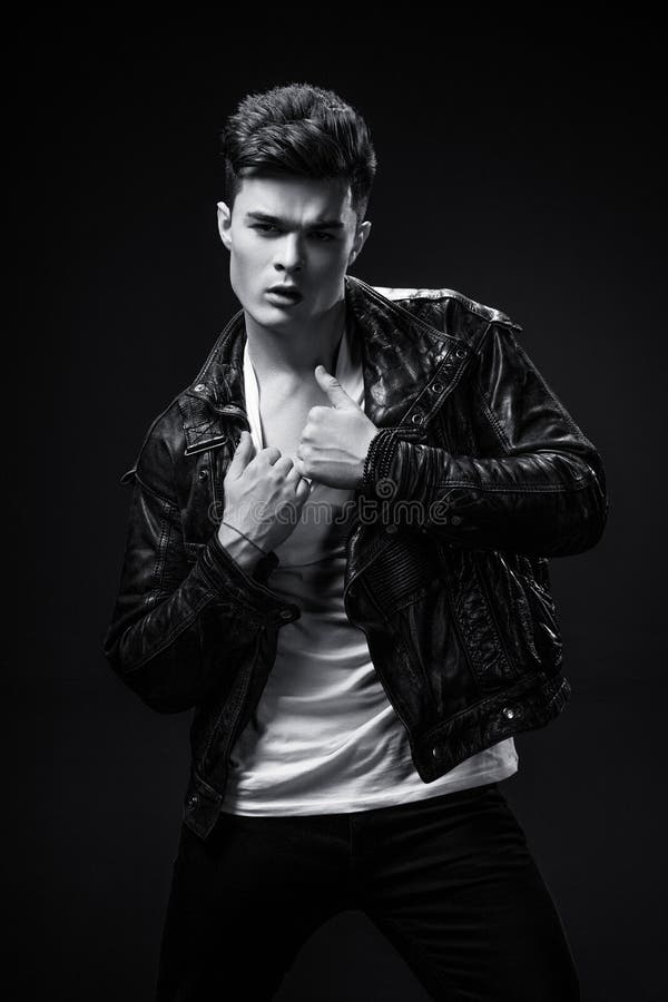 Beautiful Athletic Bodybuilder Male Model Posing in Studio. Expression