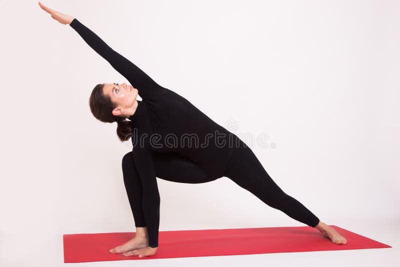 Beautiful Athletic Girl In Black Suit Doing Yoga Asanas ...