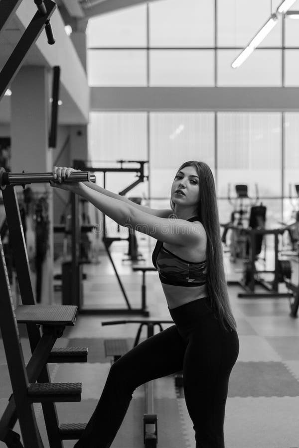 Beautiful Athletic Girl Posing in the Gym. Stock Photo Image of