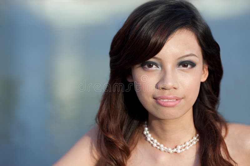 Beautiful, attractive Asian Chinese by waterside stock photography