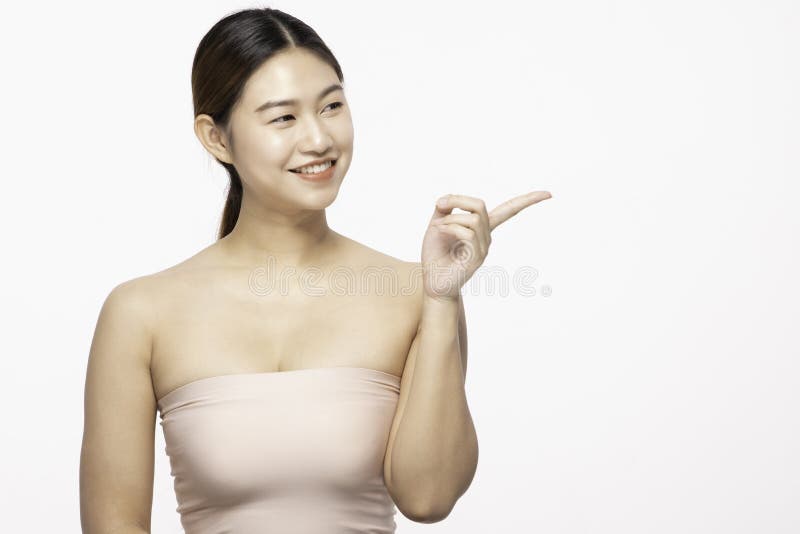 https://thumbs.dreamstime.com/b/beautiful-attractive-charming-asian-young-woman-smile-pointing-to-copy-space-display-cosmetics-product-feeling-happiness-171014884.jpg