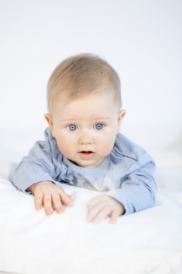 Beautiful Baby Boy Lying in Bed on White Background Stock Photo - Image ...