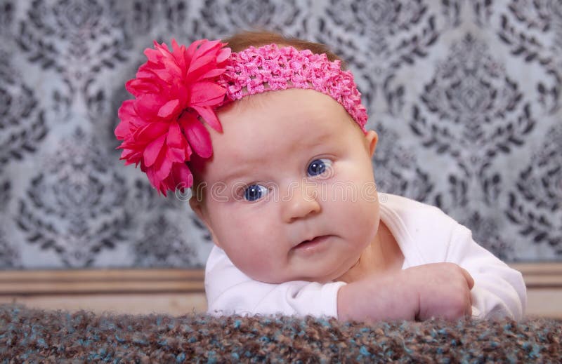 Beautiful baby with flower stock photo. Image of eyes 17917948