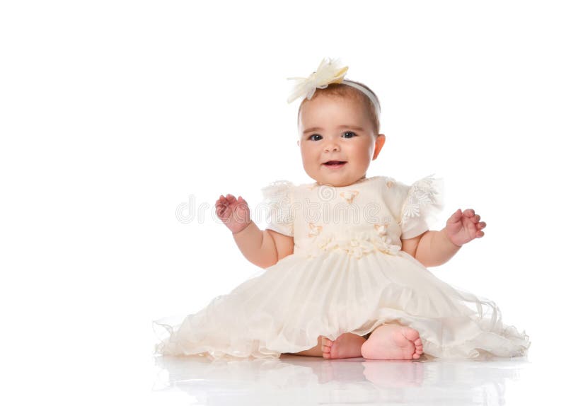 Beautiful baby girl in festive dress and headband. Beautiful baby girl child wearing festive dress and headband sitting on floor. Toddler kid looking at camera royalty free stock photos Beautiful baby girl in festive dress and headband. Beautiful baby girl child wearing festive dress and headband sitting on floor. Toddler kid looking at camera royalty free stock photos