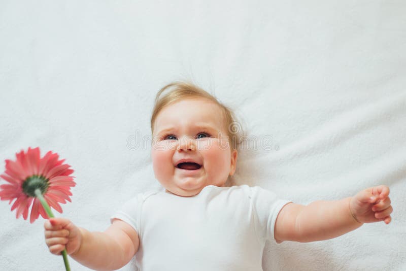 Beautiful Baby Holding A Flower On White Background Stock Photo Image