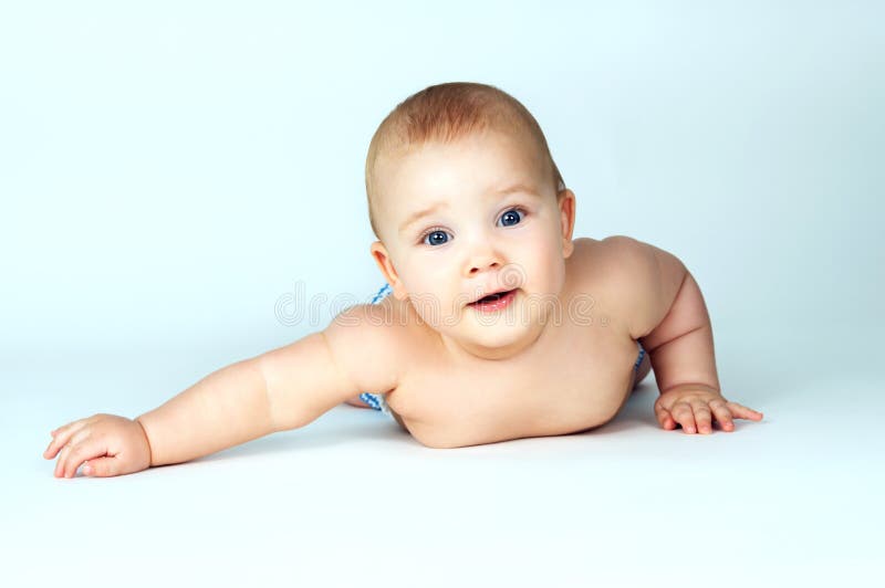 Beautiful baby lying on a background