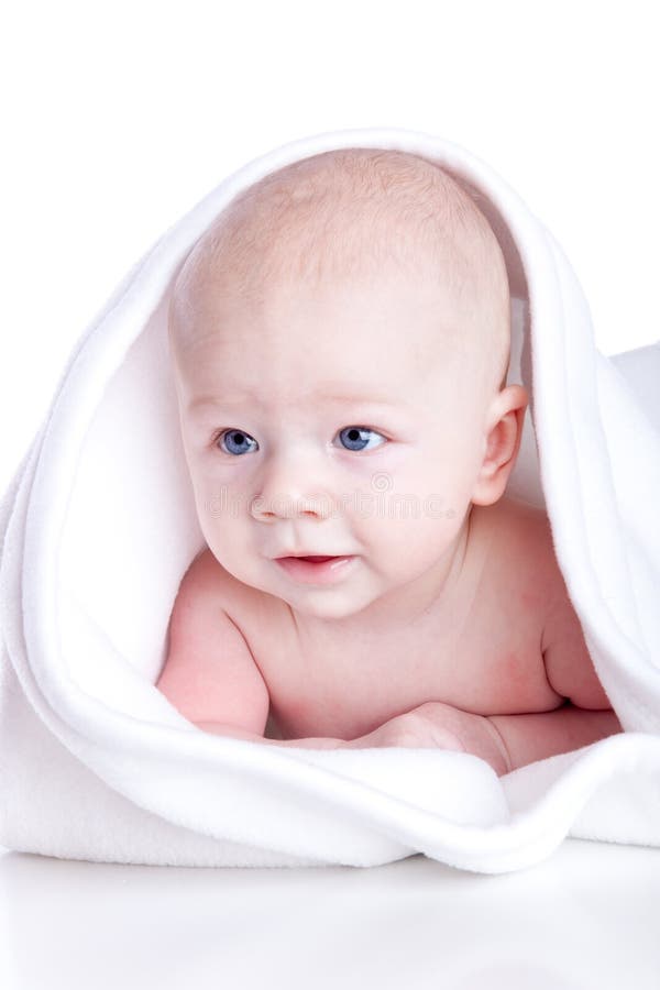 A beautiful baby under a white towel