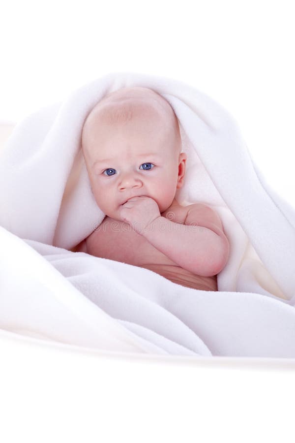 A beautiful baby under a white towel