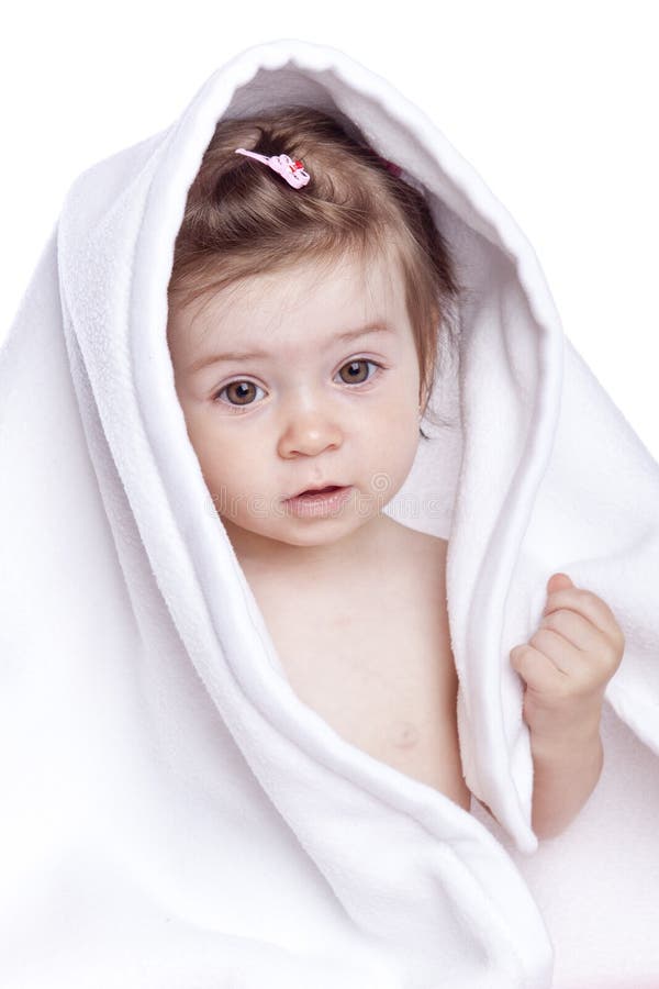 Beautiful baby under a white towel