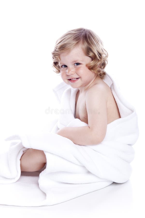 Beautiful baby under a white towel