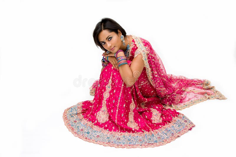 Beautiful Bengali bride in colorful dress sitting, isolated. Beautiful Bengali bride in colorful dress sitting, isolated