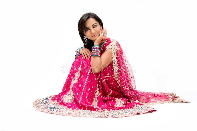 Beautiful Bengali bride in colorful dress sitting, isolated. Beautiful Bengali bride in colorful dress sitting, isolated