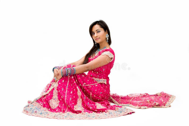 Beautiful Bengali bride in colorful dress sitting, isolated. Beautiful Bengali bride in colorful dress sitting, isolated