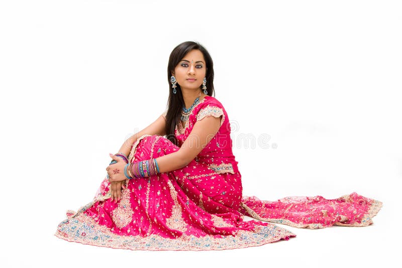 Beautiful Bengali bride in colorful dress sitting, isolated. Beautiful Bengali bride in colorful dress sitting, isolated