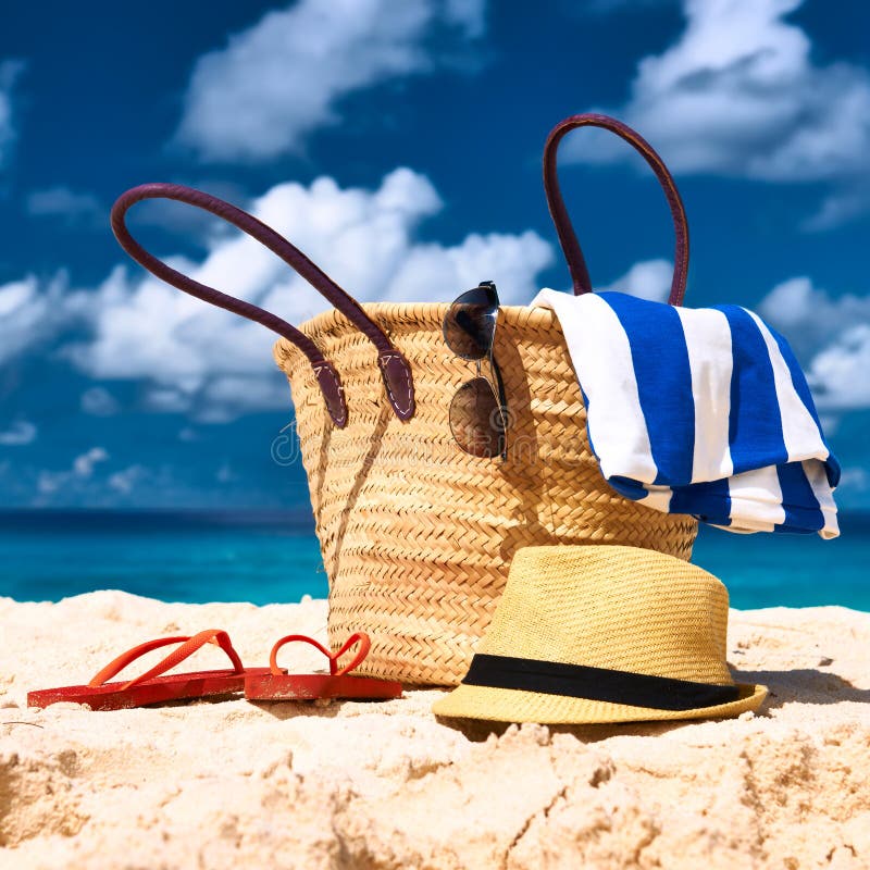 Bag, Hat and Flip-flops on the Beach Stock Image - Image of clouds ...