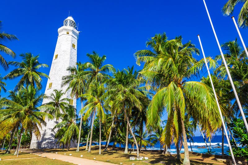Beautiful beach and lighthouse royalty free stock photo