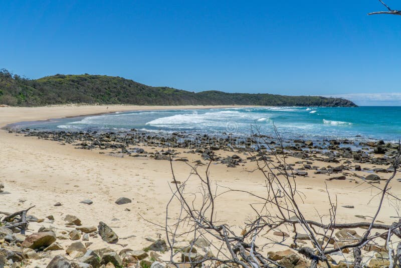 Beautiful beach of Noosa on the sunshine coast in Australia with beautiful weather and blue sky with white clouds. The beautiful beach of Noosa on the sunshine royalty free stock photography Beautiful beach of Noosa on the sunshine coast in Australia with beautiful weather and blue sky with white clouds. The beautiful beach of Noosa on the sunshine royalty free stock photography